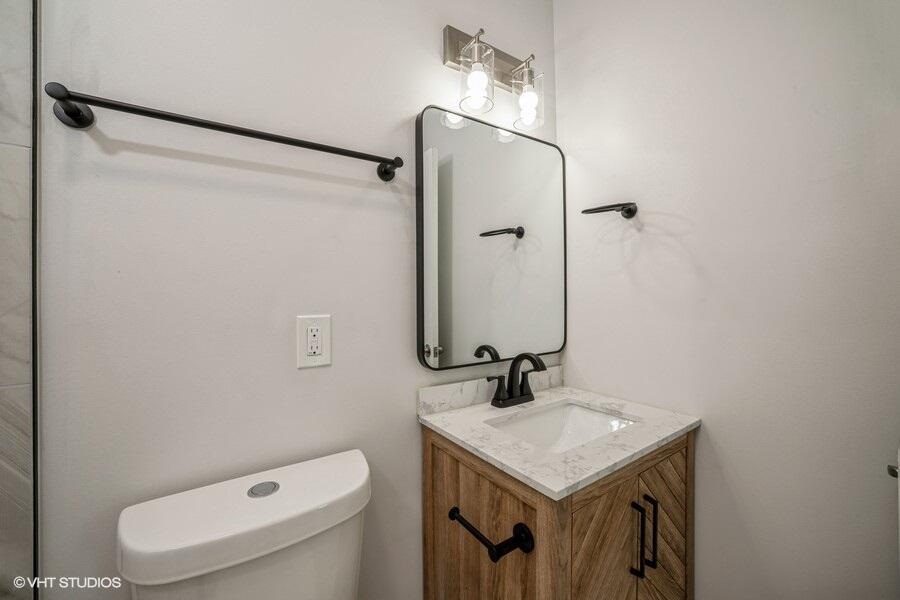 1132 Cleveland Street Hammond, IN 46320 - Photo 25 of 30 a bathroom with a sink toilet and shower