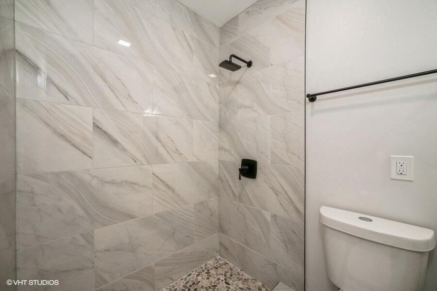 1132 Cleveland Street Hammond, IN 46320 - Photo 26 of 30 a bathroom with a shower and a toilet