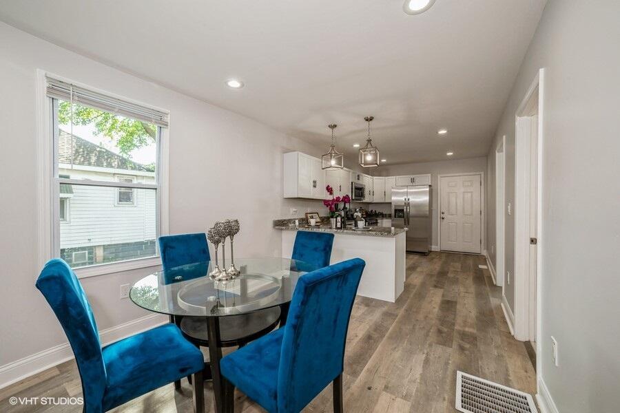 1132 Cleveland Street Hammond, IN 46320 - Photo 8 of 30 a view of a dining room with furniture and wooden floor