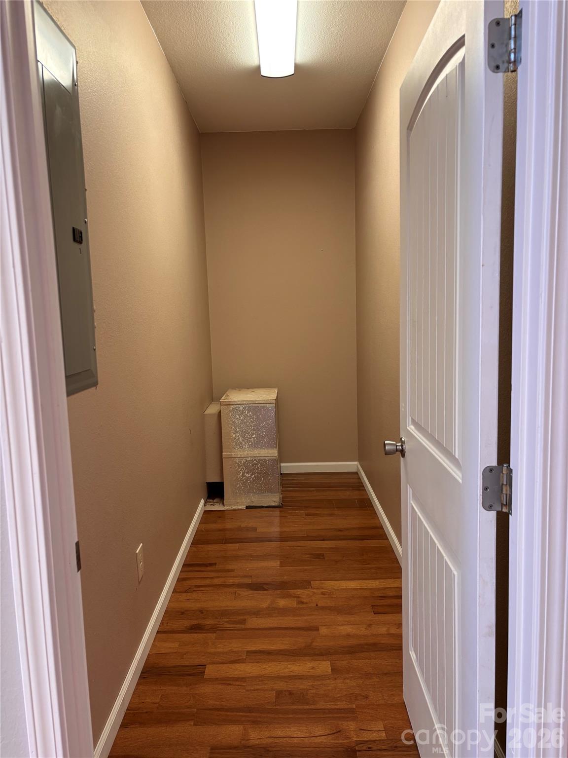 250 Duckett Cove Road Waynesville, NC 28786 - Photo 21 of 23 a view of a hallway with wooden floor and staircase