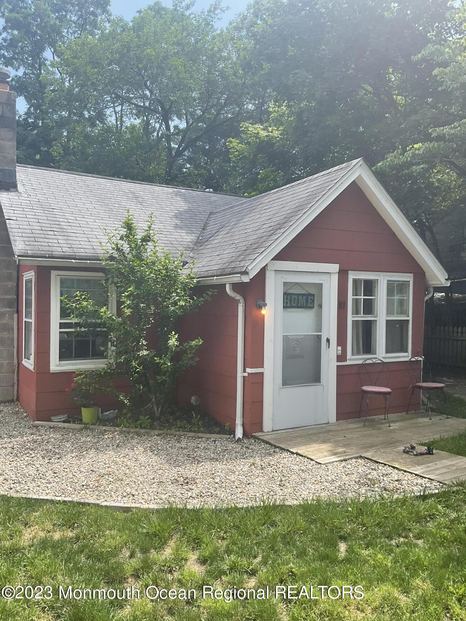 87 Cedarhurst Road Brick, NJ 08723 - Photo 2 of 14 a front view of a house with garden