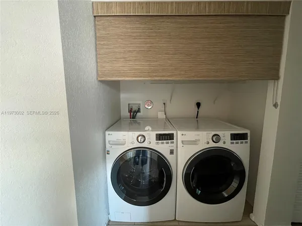a utility room with dryer and washer