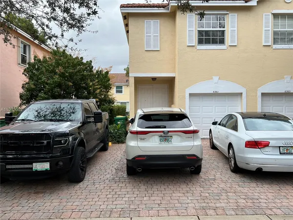 a car parked in front of a house