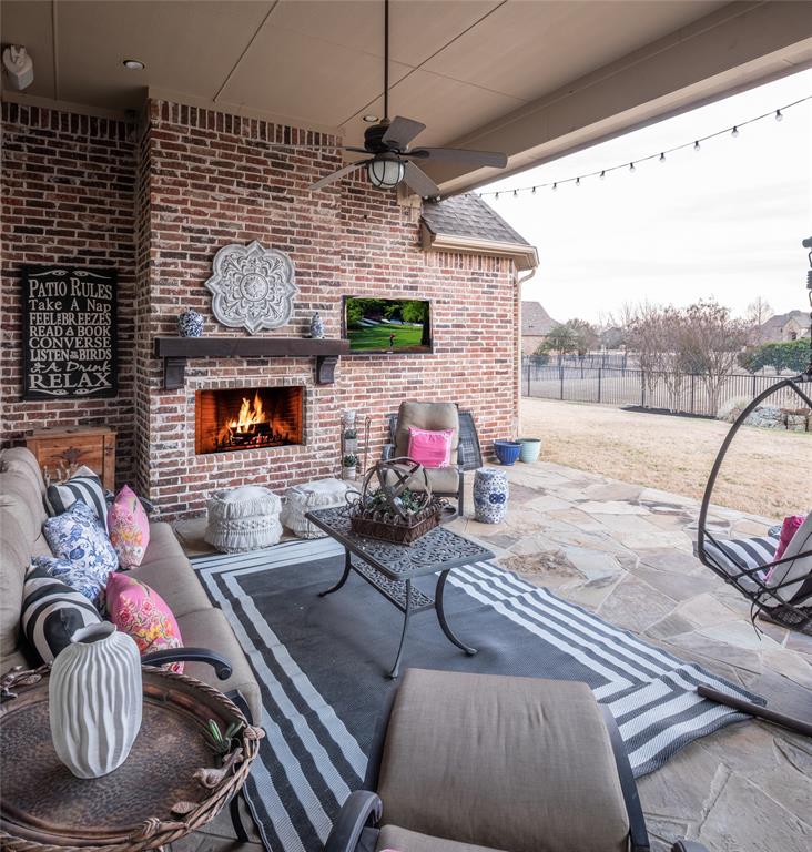 811 Red Store Court Lucas, TX 75002 - Photo 24 of 31 a living room with furniture and a flat screen tv