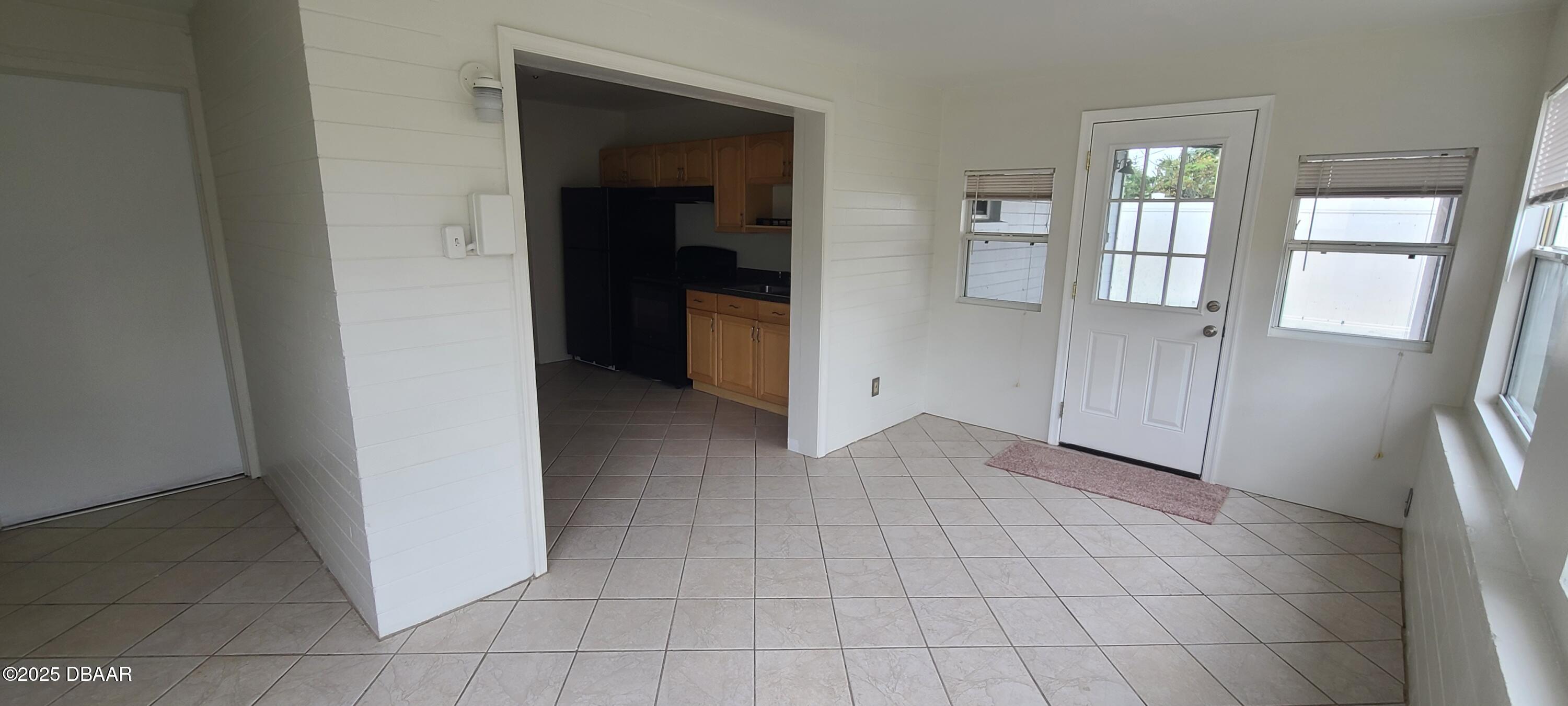 54 Seaside Drive Ormond Beach, FL 32176 - Photo 7 of 12 wooden floor in an empty room and a mirror
