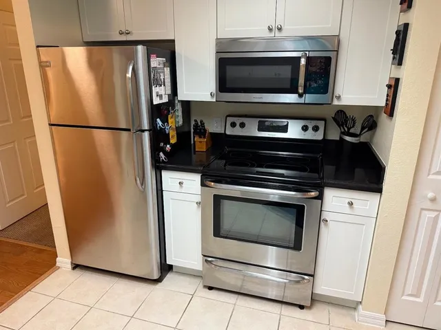 a kitchen with a stove microwave and refrigerator