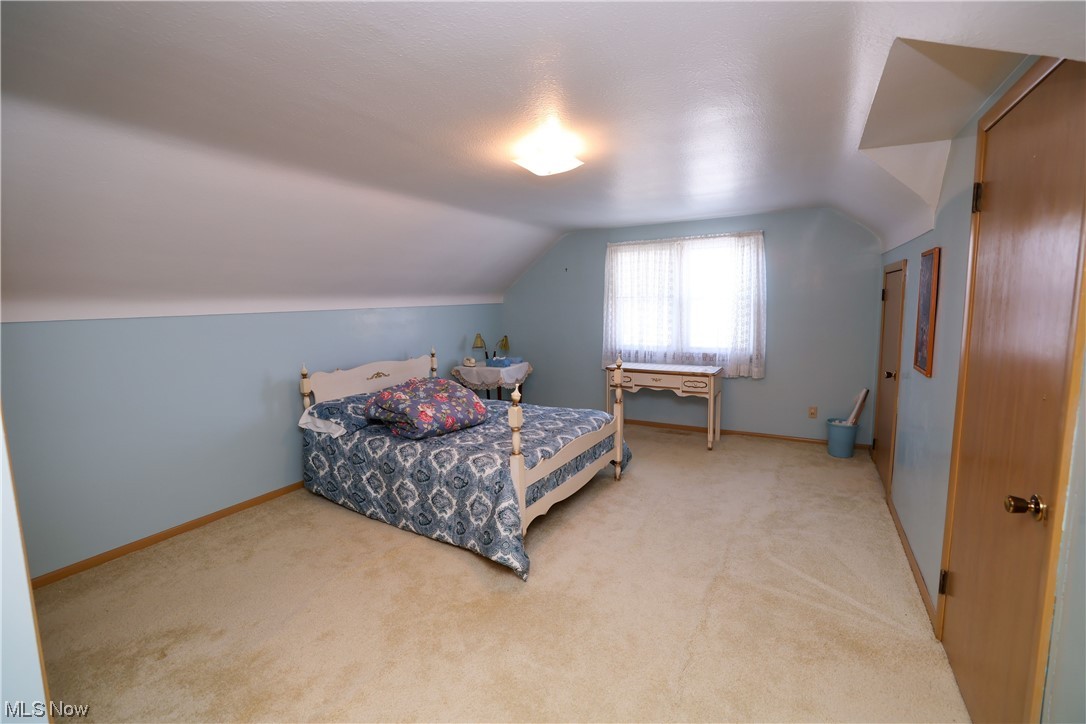 29252 Barjode Road Willowick, OH 44095 - Photo 15 of 21 Bedroom with vaulted ceiling and light colored carpet