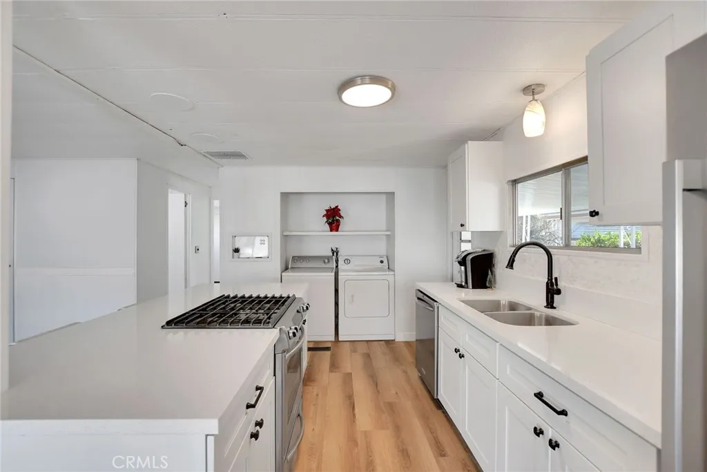 840 Foothill, Unit 27 Azusa, CA 91702 - Photo 15 of 30 a kitchen with white cabinets and sink