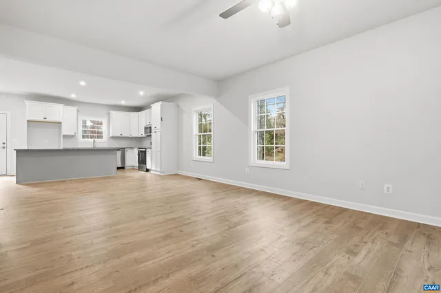 a view of a kitchen with a sink and a window