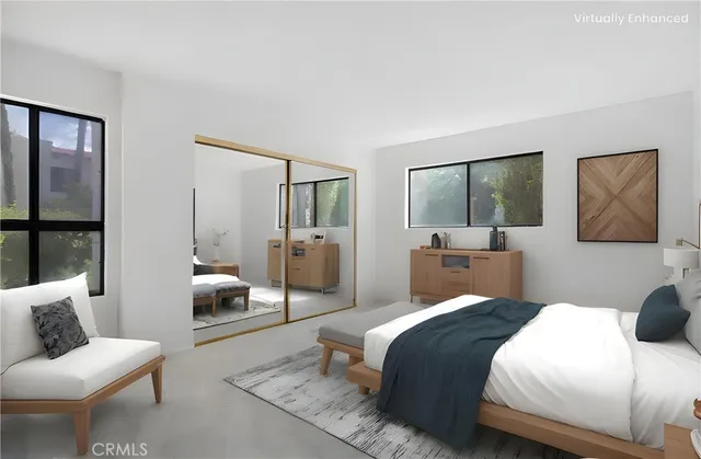 a bedroom with a large bed and a couch