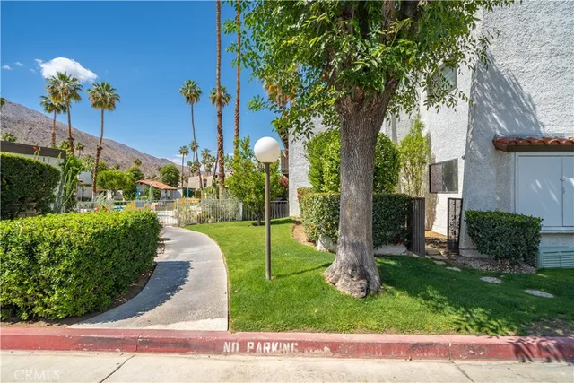 a couple of potted plants in front of door