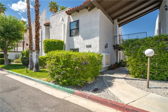 a view of a swimming pool with chairs