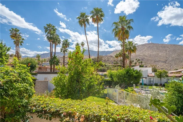 an aerial view of a house with a garden and pool