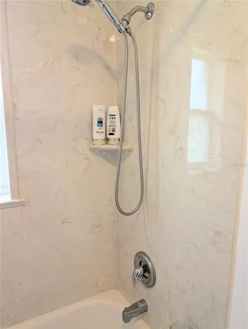 a bathroom with a bath tub