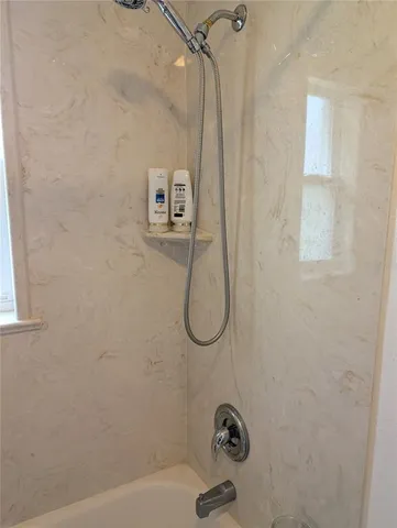 a bathroom with a bath tub