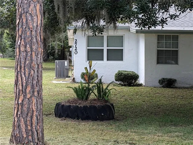 a house view with a garden space