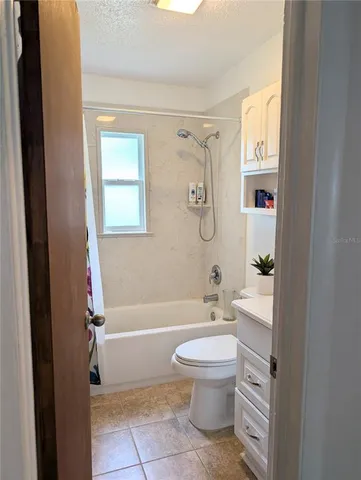 a bathroom with a toilet a sink and a bathtub