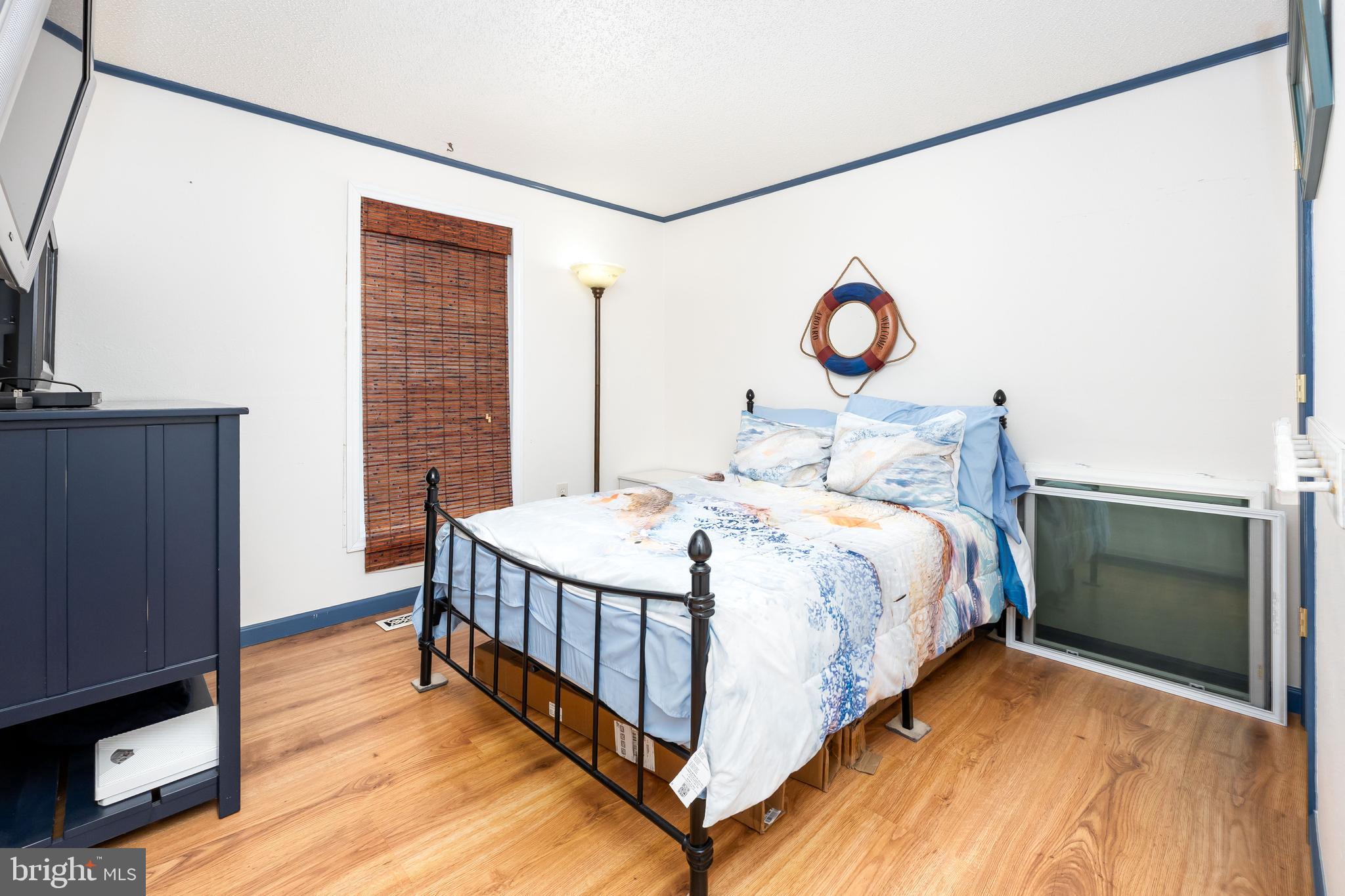 7940 Riverview Road Westover, MD 21871 - Photo 37 of 93 a bedroom with a bed and a window