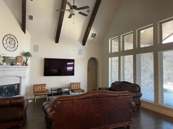 a living room with furniture and a flat screen tv