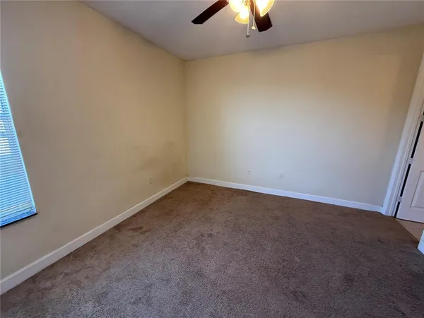an empty room with a empty space and window