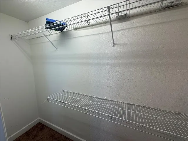 a view of a room with racks on the wall