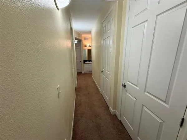 a view of a bathroom from the hallway