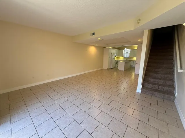 a view of a room with a table and chairs