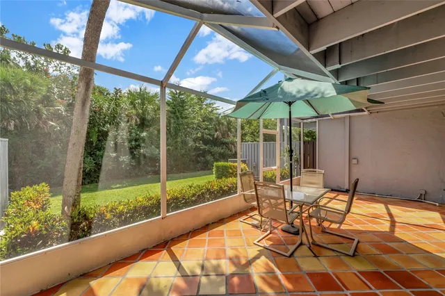 a bedroom with two beds and a large window
