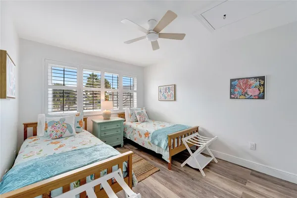 a bedroom with bed and a window