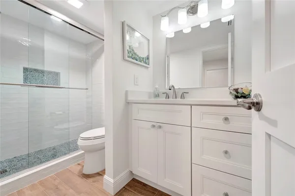 a bathroom with a bathtub and shower