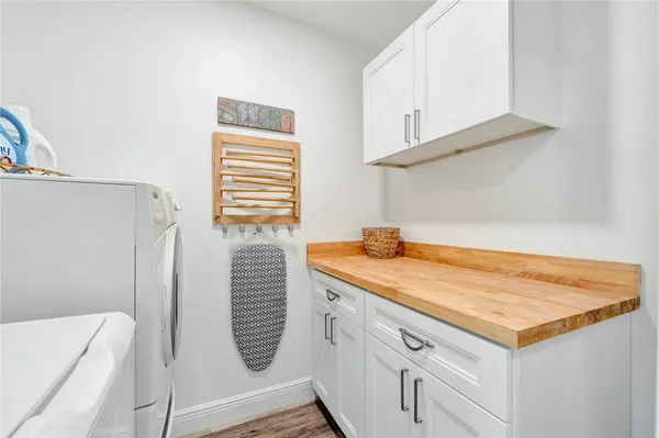 a bathroom with a double vanity sink and a bathtub