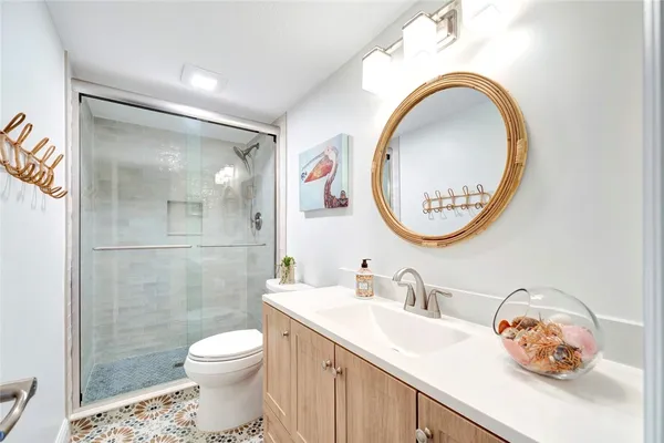 a bedroom with two beds and a large window