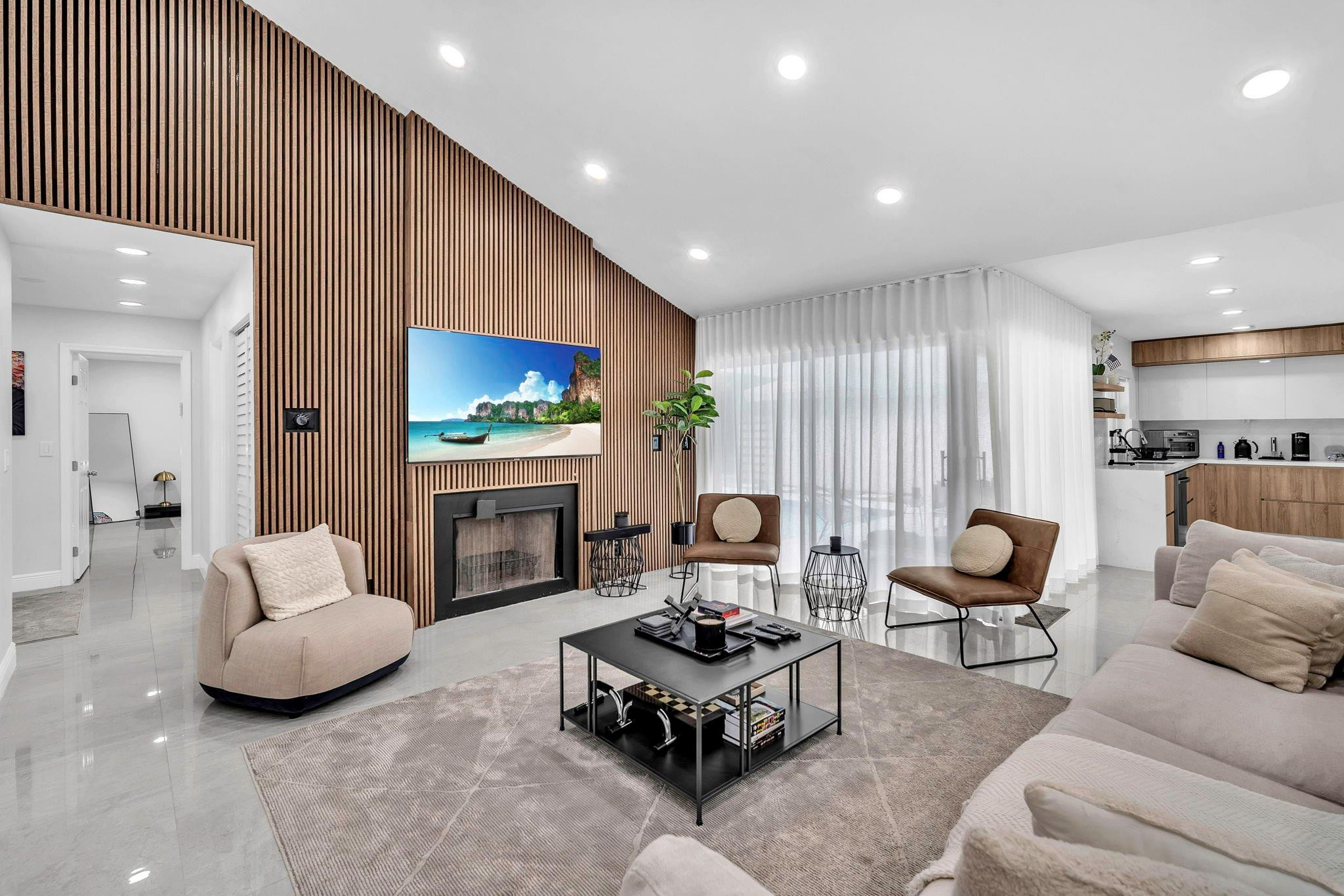 a living room with furniture fireplace and window