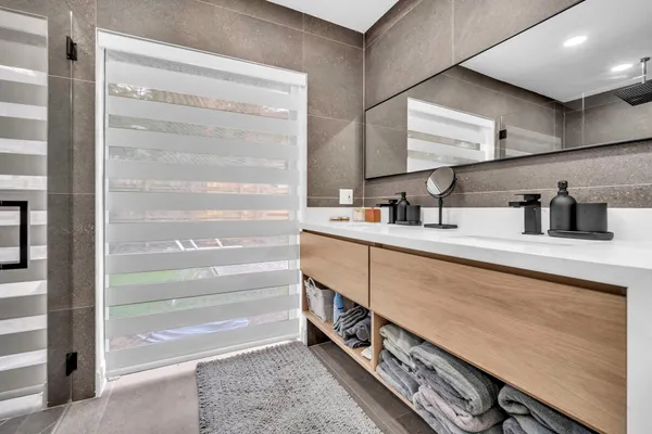 a view of walk in closet and window