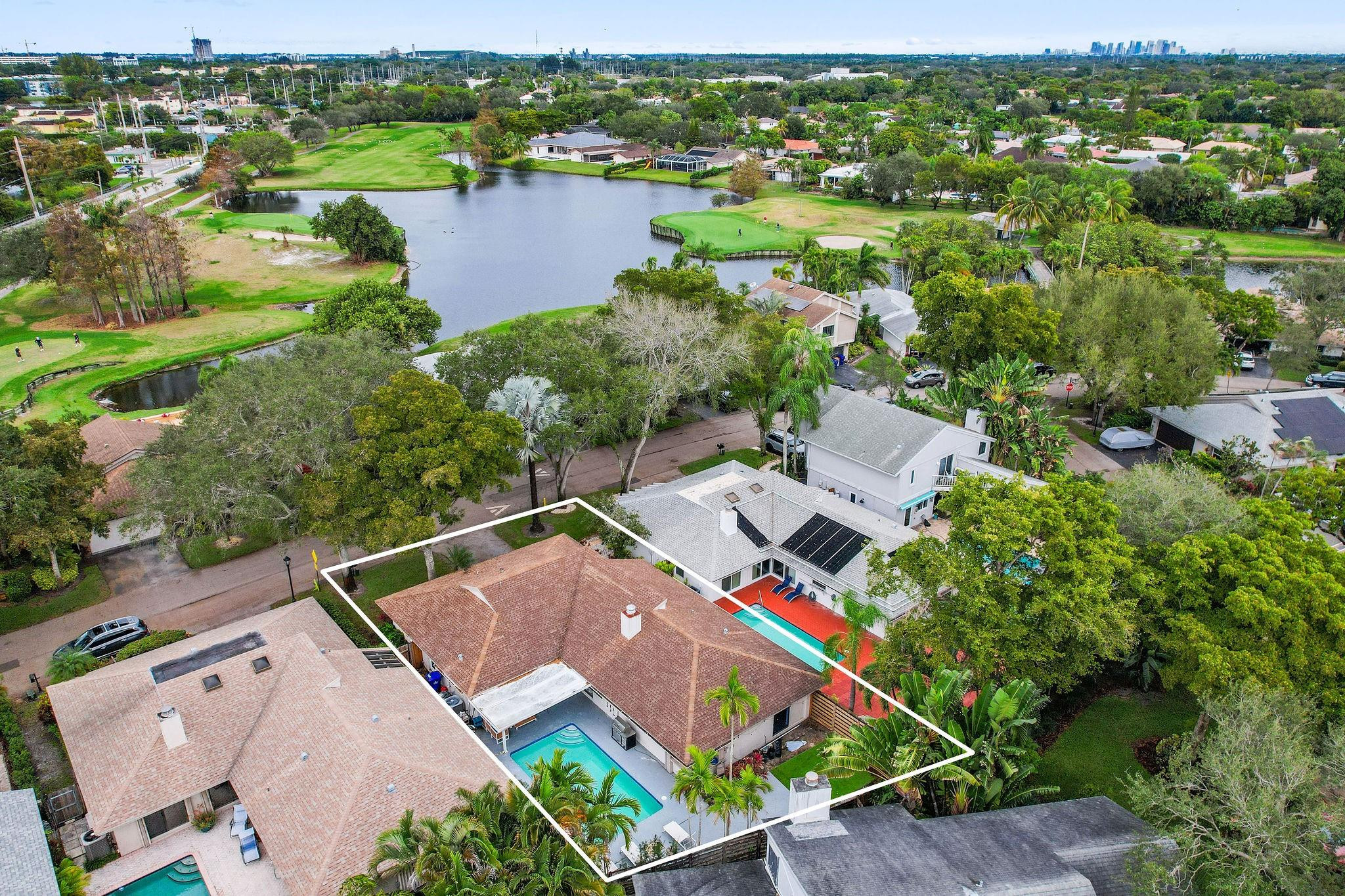 136 Greens Road Hollywood, FL 33021 - Photo 31 of 32 an aerial view of residential houses with outdoor space and river