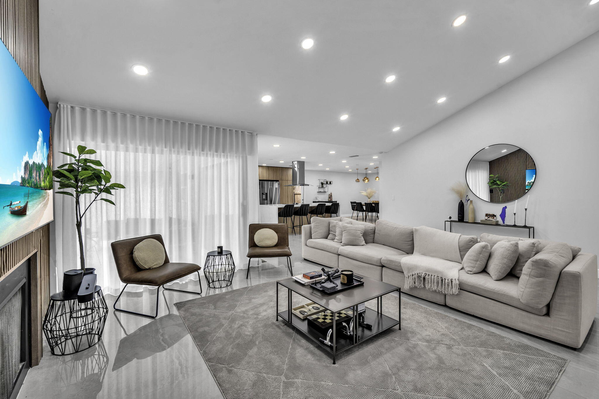 136 Greens Road Hollywood, FL 33021 - Photo 4 of 32 a living room with furniture a rug and a potted plant