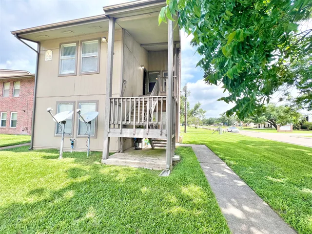 a view of front door of house with yard