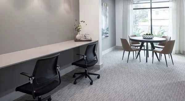 a view of a room with furniture and window