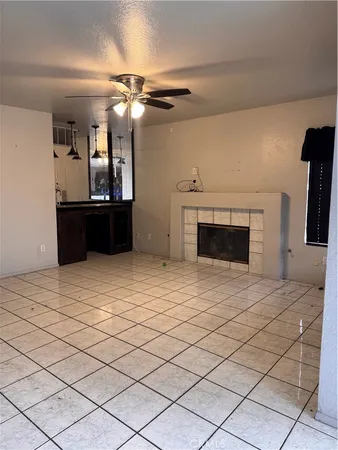 a bedroom with a bed and a fireplace