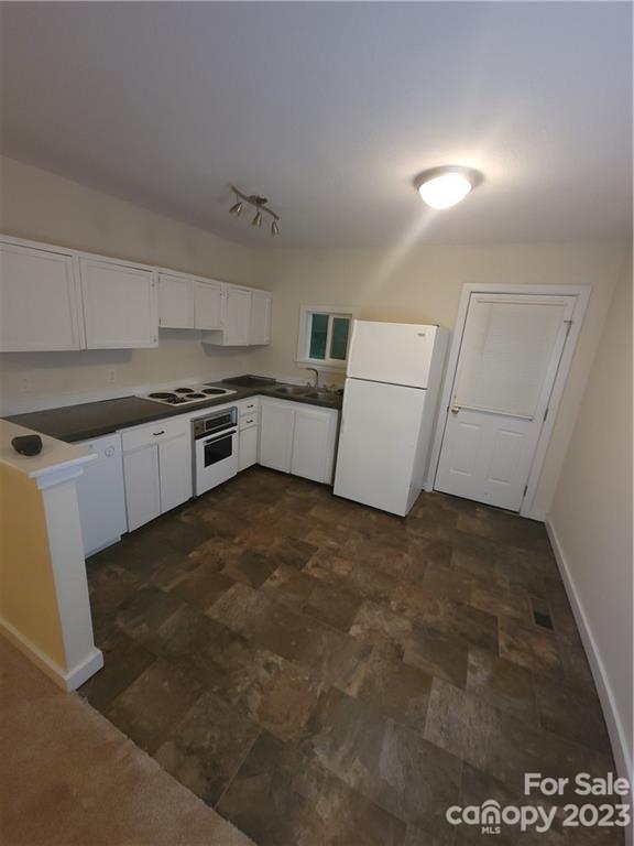362 Ewaldz Road Blacksburg, SC 29702 - Photo 3 of 13 a large white kitchen with sink and stainless steel appliances