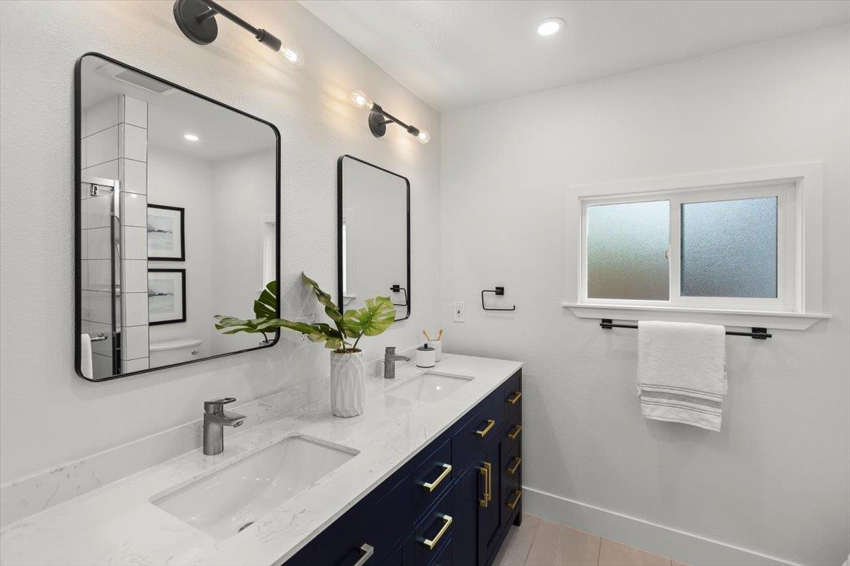 699 Cambrian Drive Campbell, CA 95008 - Photo 16 of 35 a bathroom with double vanity sinks and a mirror