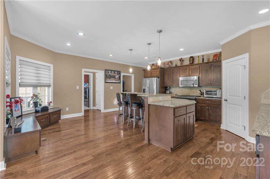 2510 South Potter Road Lancaster, SC 29720 - Photo 10 of 39 a kitchen with a sink cabinets and wooden floor