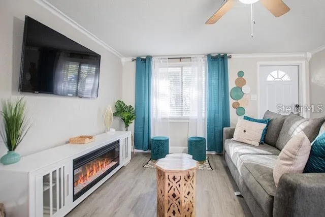 a living room with furniture fireplace and flat screen tv
