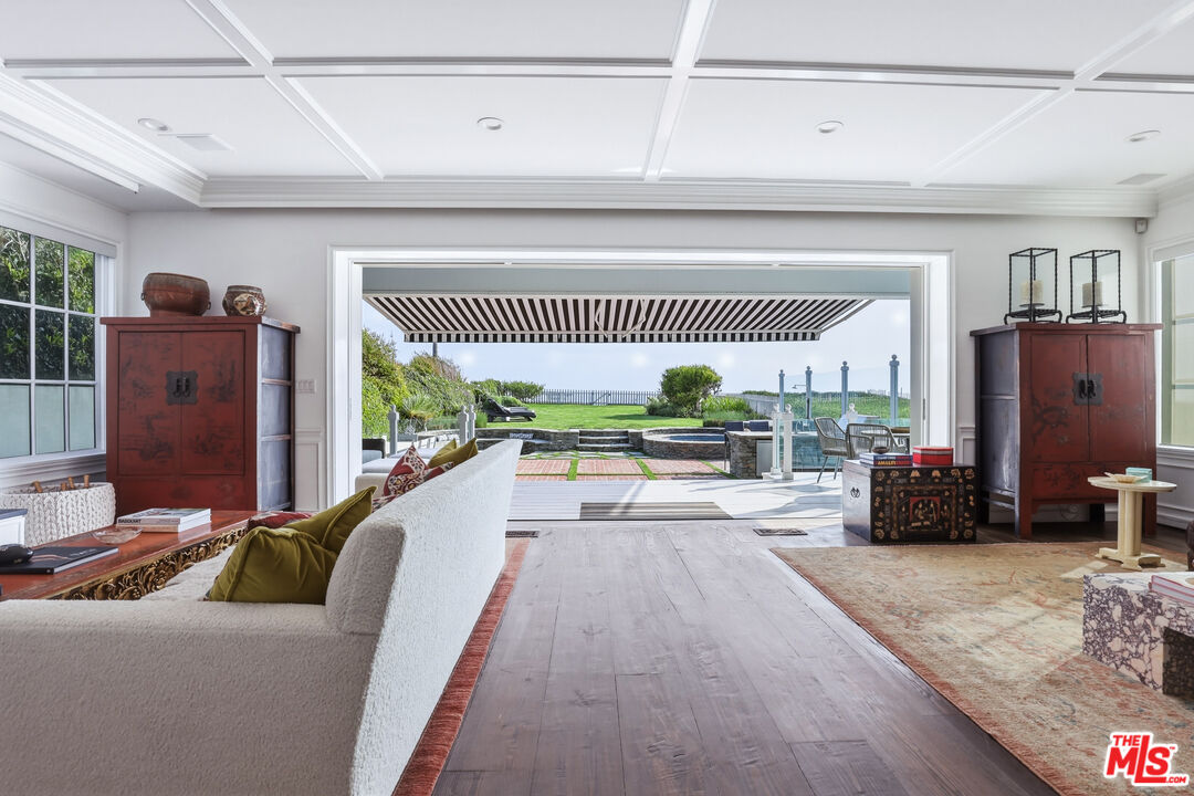 30810 Broad Beach Road Malibu, CA 90265 - Photo 25 of 55 a living room with furniture and a floor to ceiling window