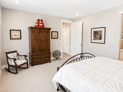 a bedroom with a bed and cabinets
