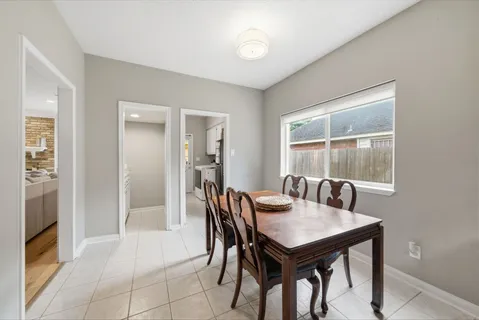 a view of a dining room with furniture and window