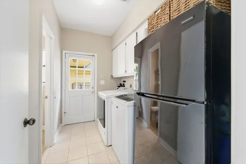 a utility room with closet dryer and washer