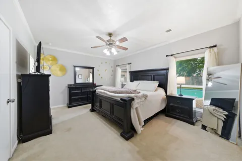 a bed room with a bed dresser and a window