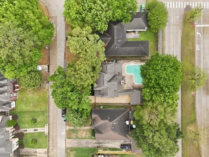an aerial view of a house with outdoor space