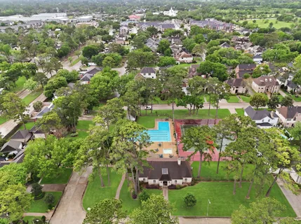 an aerial view of a houses with yard